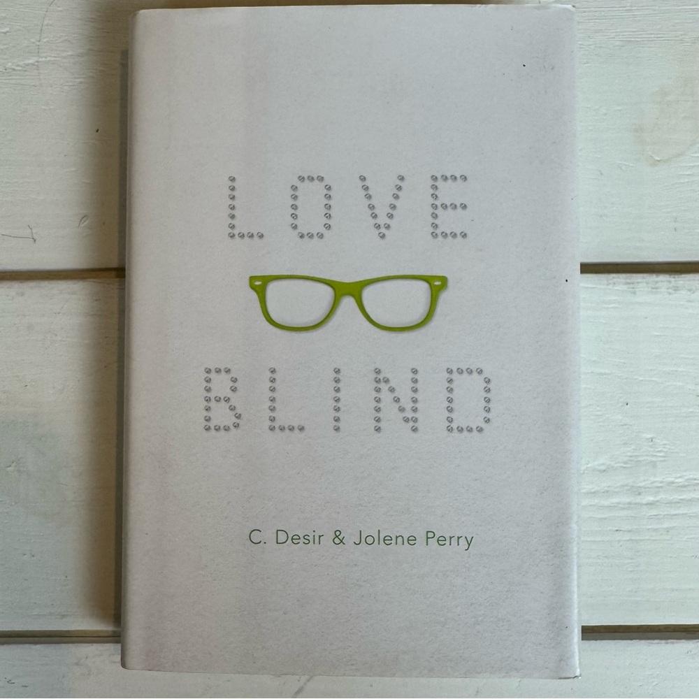 Love Blind Book by C. Desir and Jolene Perrywith Green Accents
